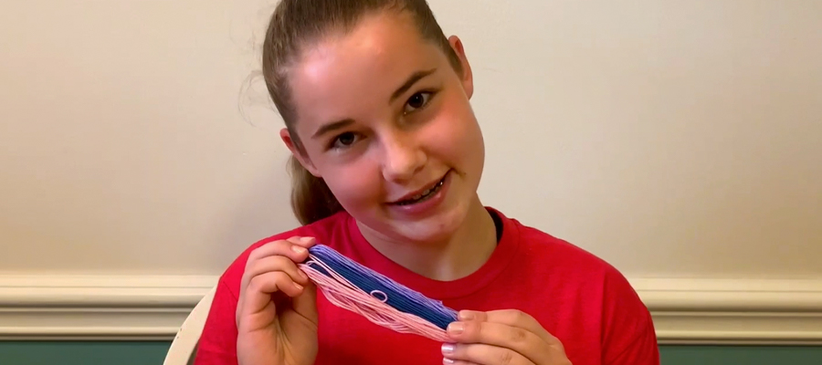 Girl holding a friendship bracelet image