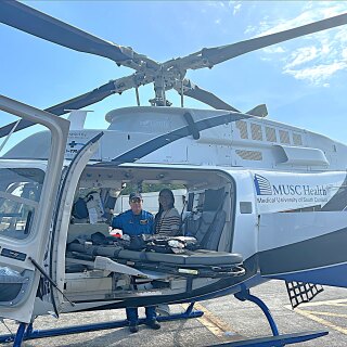 Palak Patel posing in MUSC medical helicopter