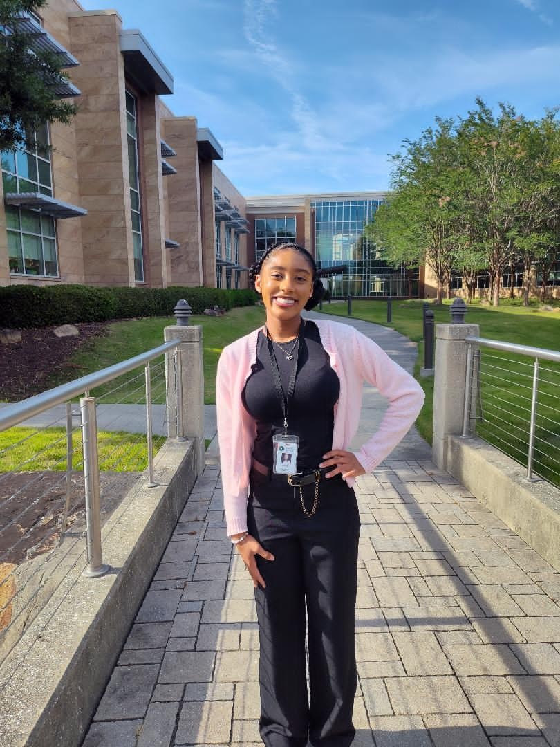 Arielle Mazique standing in front of the State Health Campus