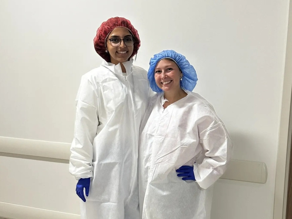 Palak Patel and colleague in white scrubs