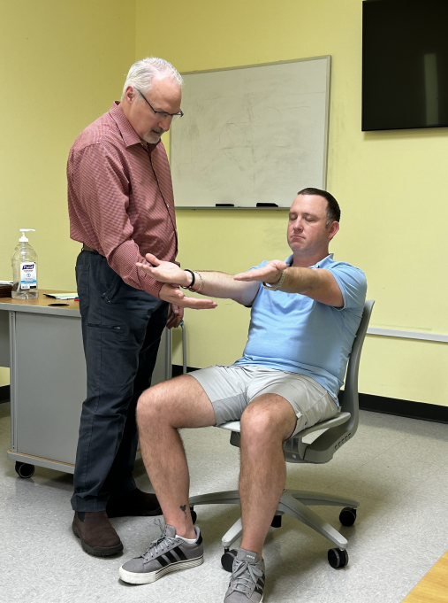 Medical provider teaching stroke training in a classroom