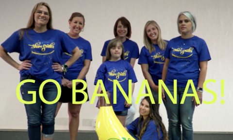 women wearing blue shirts with "go bananas" text overlaid